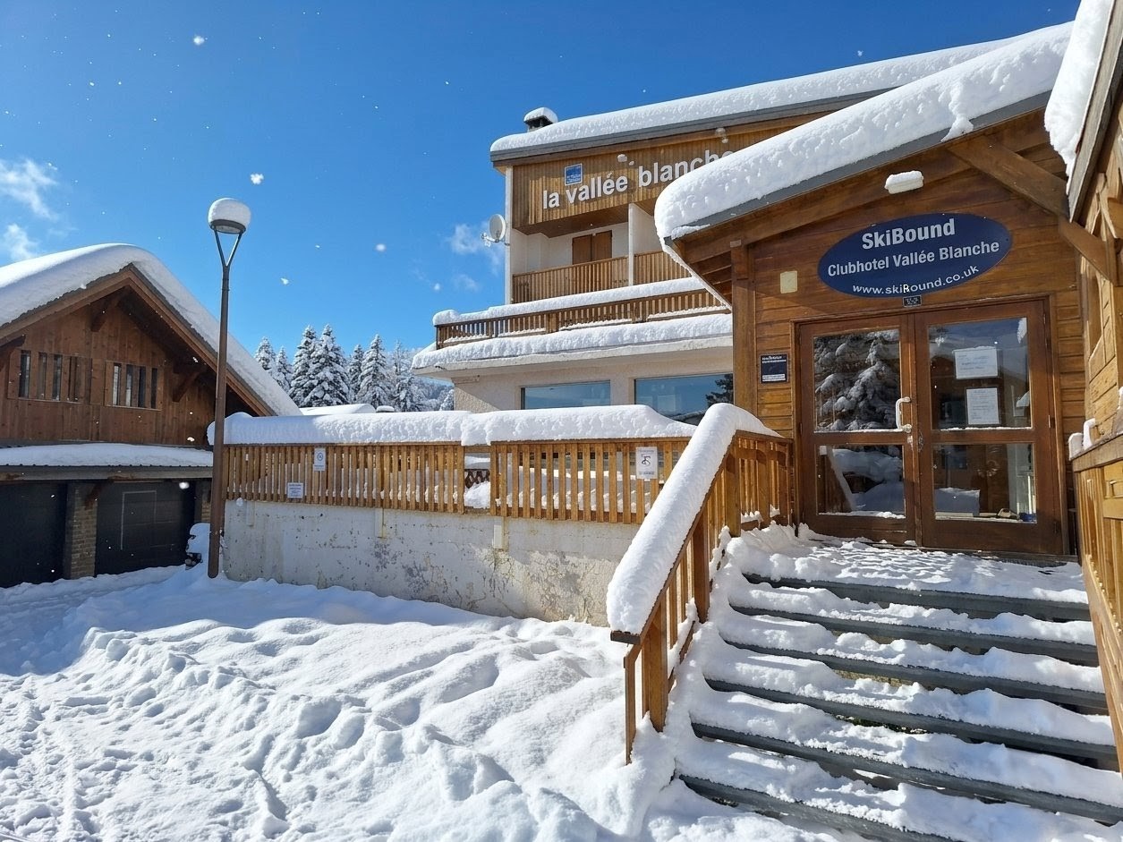The entrance to the Vallée Blanche Clubhotel covered in snow in Alpe d'Huez