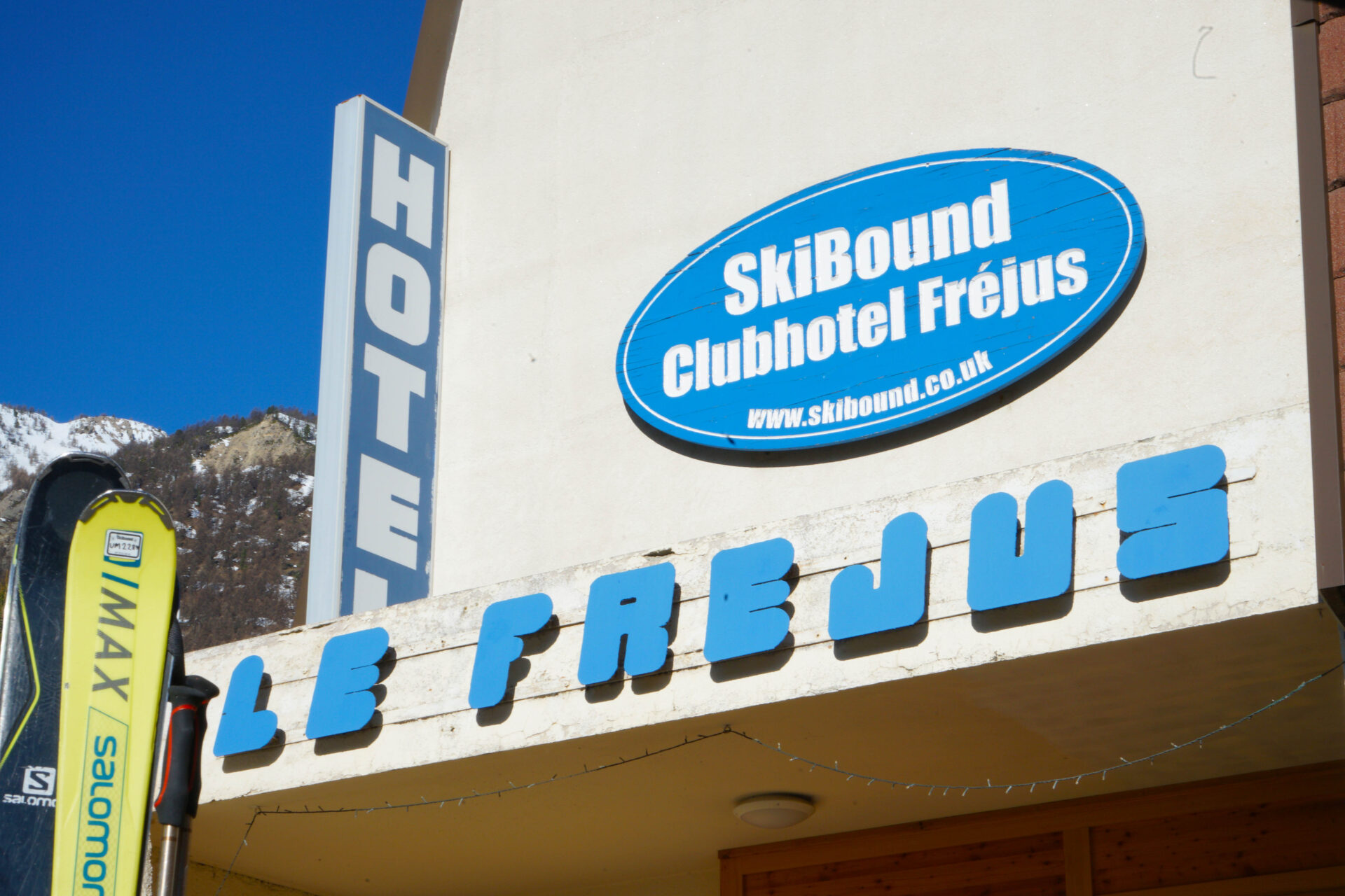 Blue sign above the Clubhotel Frejus main entrance in Serre Chevalier, France