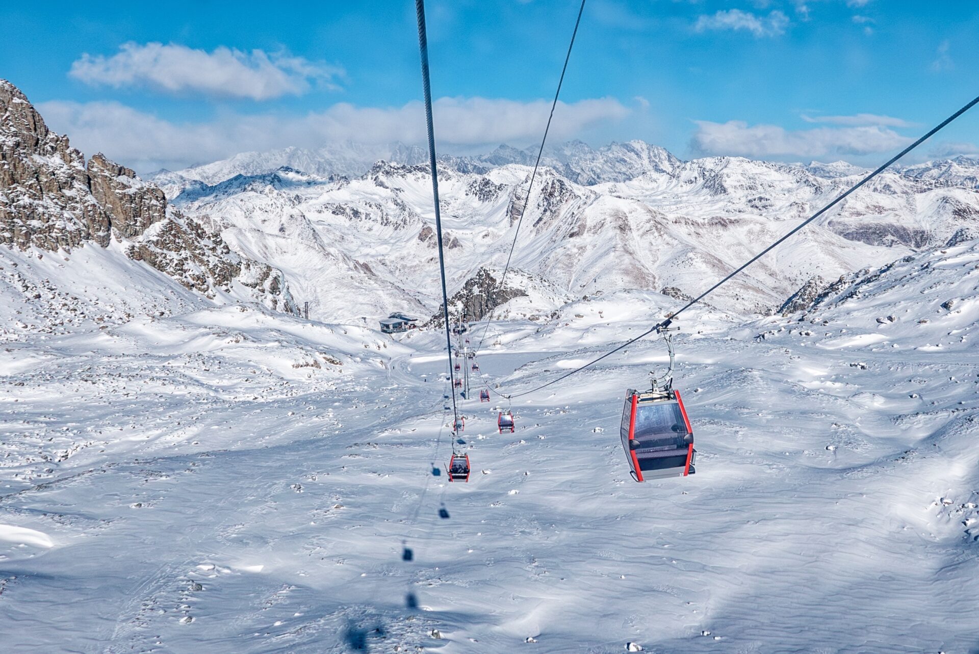 A ski gondola going down the mountain in Passo Tonale.