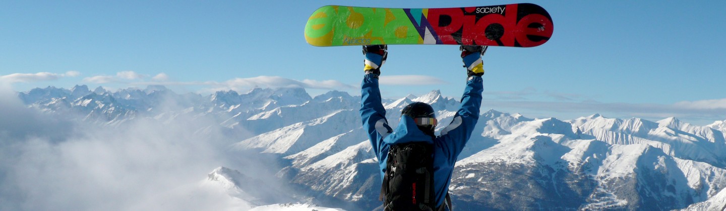 Snowboarder celebrating the view