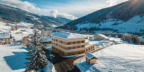 Aerial view of the Pension Muhlbacherhof in Oberlungau, Austria