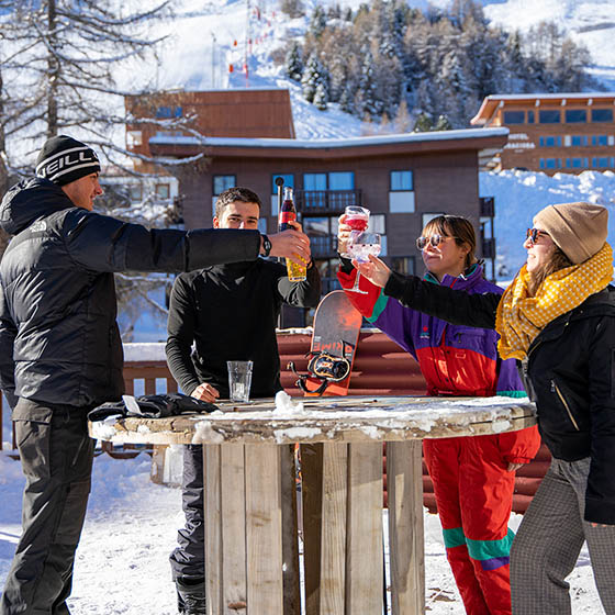 Teachers having a drink outside the ho36 in La Plagne, France
