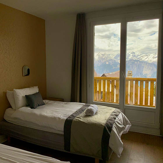 Bedroom with a view at Clubhotel Vallee Blanche, Alpe d'Huez