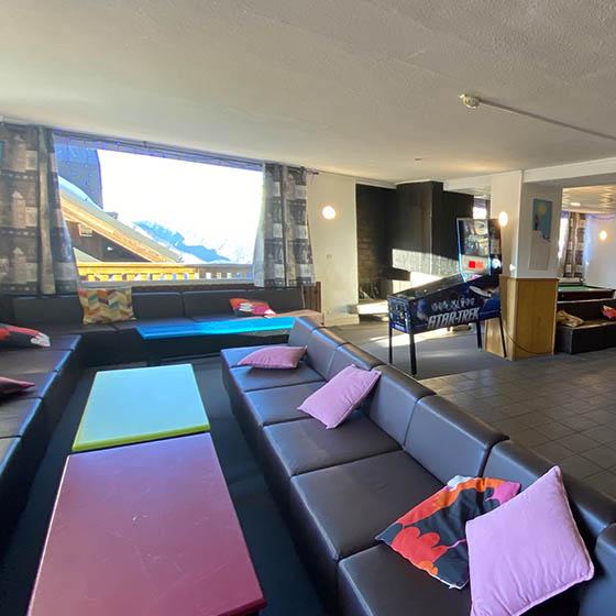 Colourful lounge area with a view at Clubhotel Vallée Blanche in Alpe d'Huez