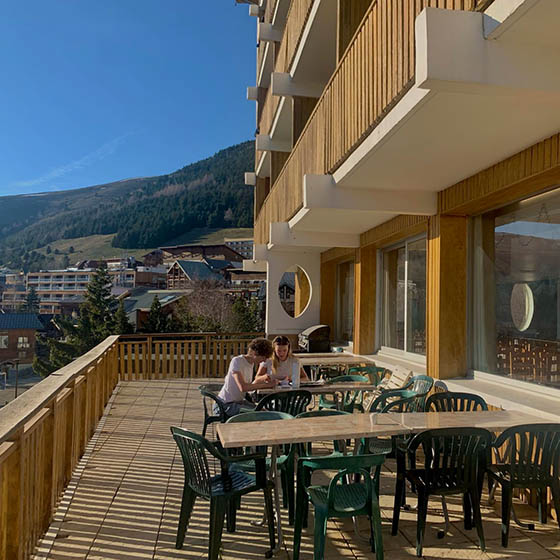 Outdoor terrace in the sunshine at Clubhotel Vallee Blanche