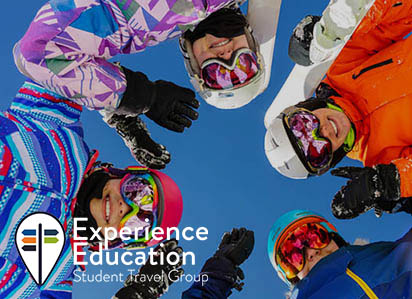 Family posing with ski gear on the slopes
