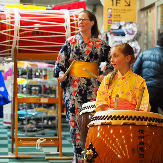 Young student trying traditional instruments in Japan