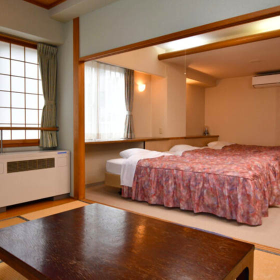Bedroom at the Marukin Ryokan hotel in Happo Village, Japan