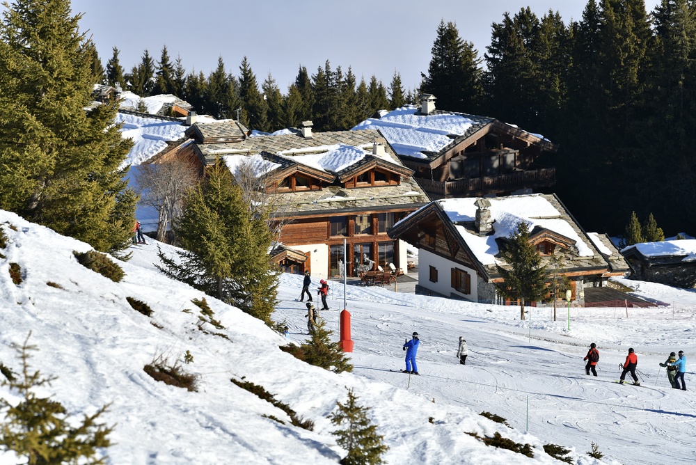 Skiers in Courchevel near the village