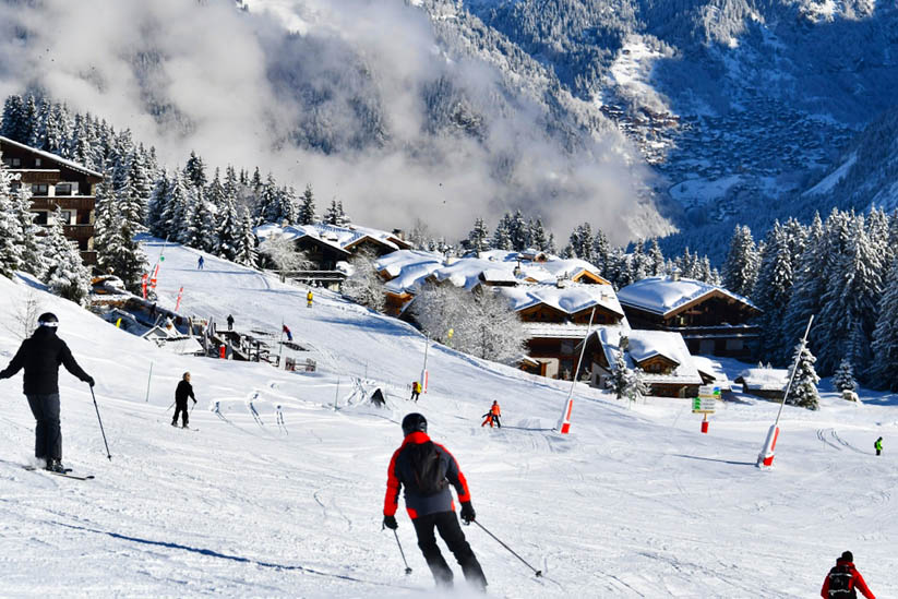 Skier sliding down the pistes in Courchevel in the French Alps