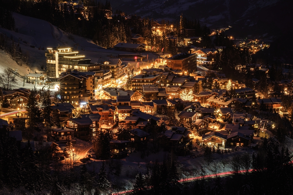 Courchevel village lit up at night