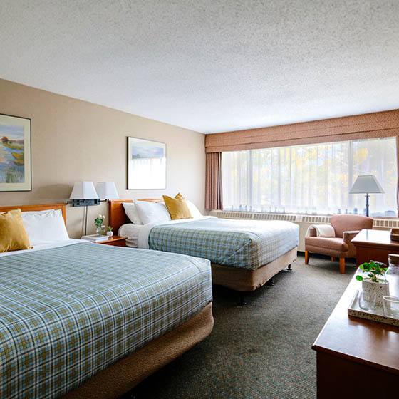 Deluxe bedroom at the Lobstick Lodge in Jasper, Canada