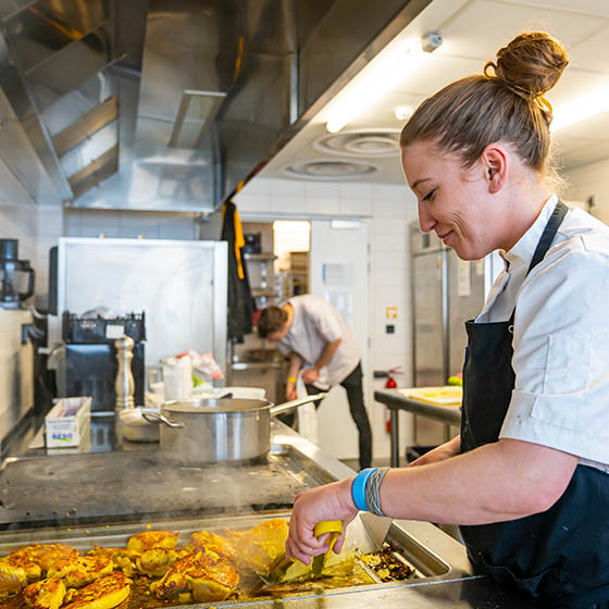 Member of staff preparing food at the APEX2100 in Tignes, France