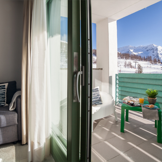 Bedroom and terrace at the Olympic Village in Sestriere, Italy