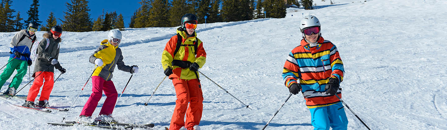 Group of teenagers skiing downhill in Austria