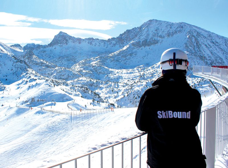 SkiBound rep looking at the snowy mountains in Andorra