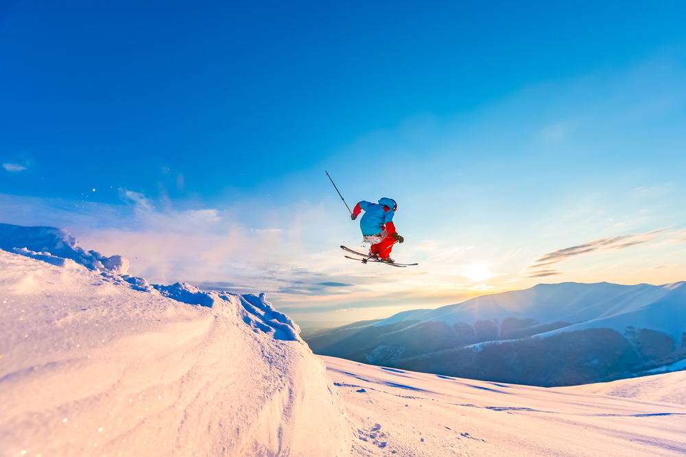 A skiier jumping