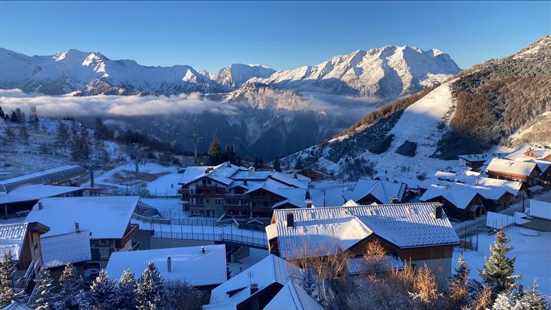 View over the snowy mountains from the top of the Vallée Blanche clubhotel