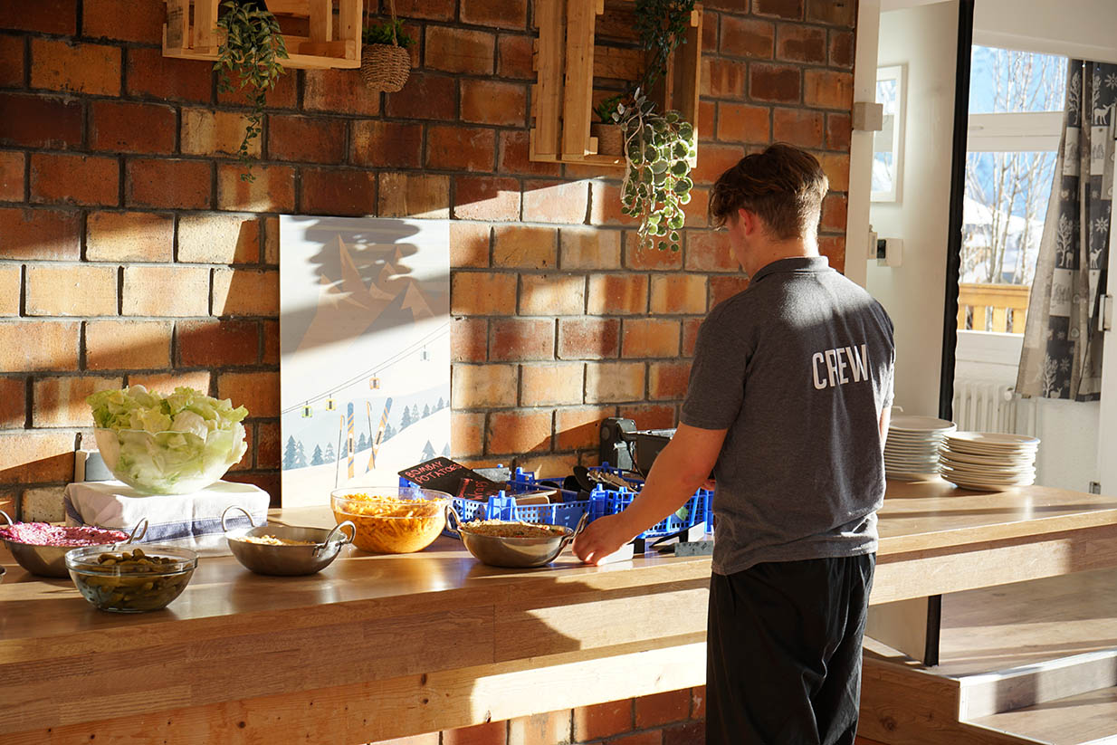 Kitchen staff setting up the food at the Vallée Blanche clubhotel in Alpe d'Huez