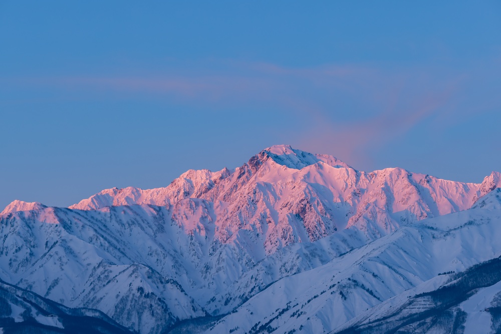 Pink sunset over Mount Goryu in Japan
