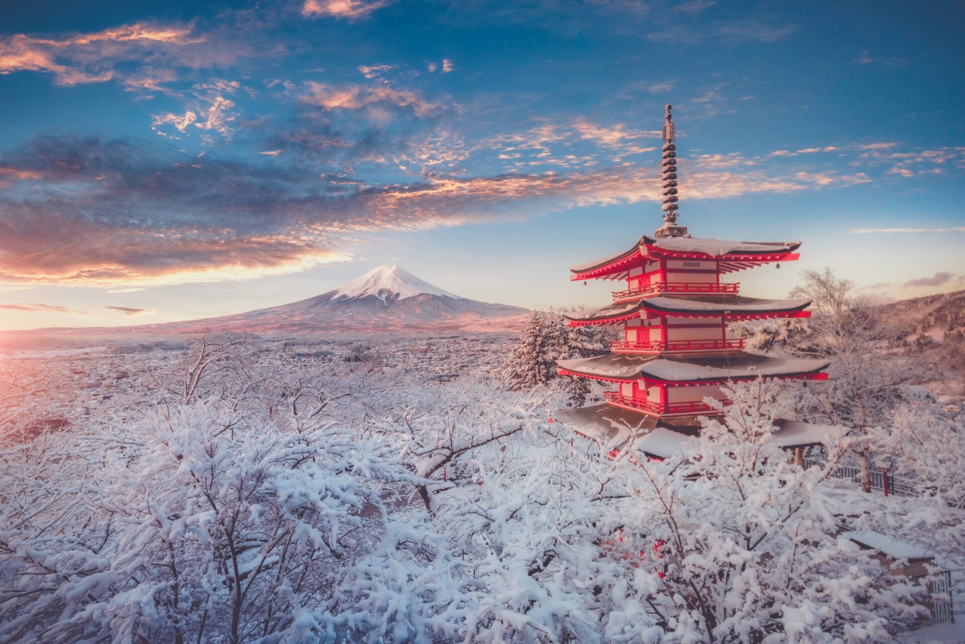 Chureito Pagoda and Mount Fuji covered in snow at sunset
