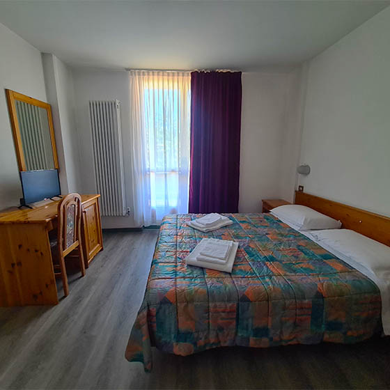 Bedroom at the Hotel Fraiteve in Cesana, Italy