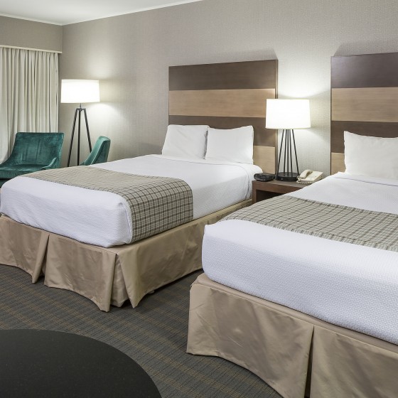 Room with two double beds at Golden Eagle Resort, Stowe