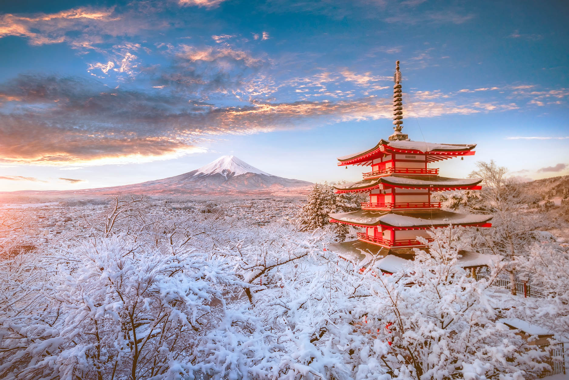 Chureito Pagoda and Mount Fuji covered in snow at sunset